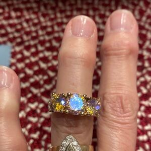 Dazzling Gold Tone Ring with Yellow and Iridescent Stones